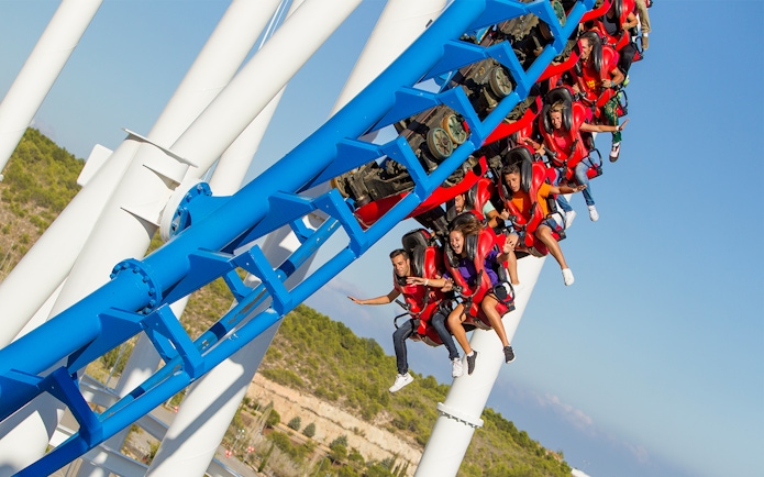 Roller coaster ride at Terra Mitica with passengers in mid-air.