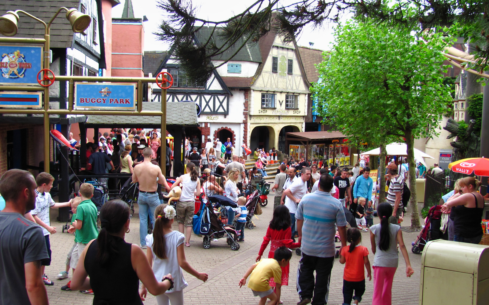 Crowd enjoying the village-themed area at Chessington World of Adventures Resort.
