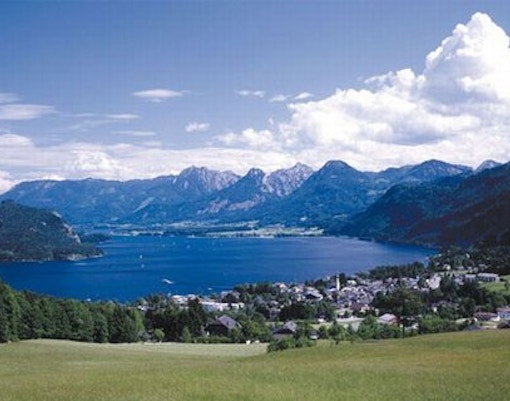 Lakes and mountains near Salzburg with a view of a village by the water.