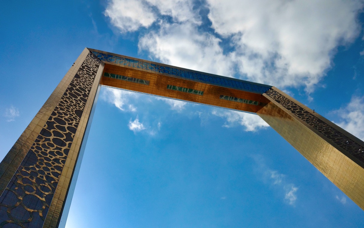 Dubai Frame against a blue sky, part of Combo: Infinity des Lumières tour.