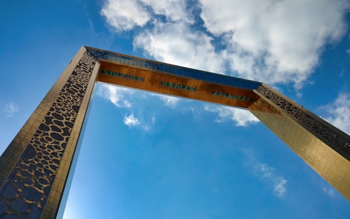 Dubai Frame against a blue sky, part of Combo: Infinity des Lumières tour.