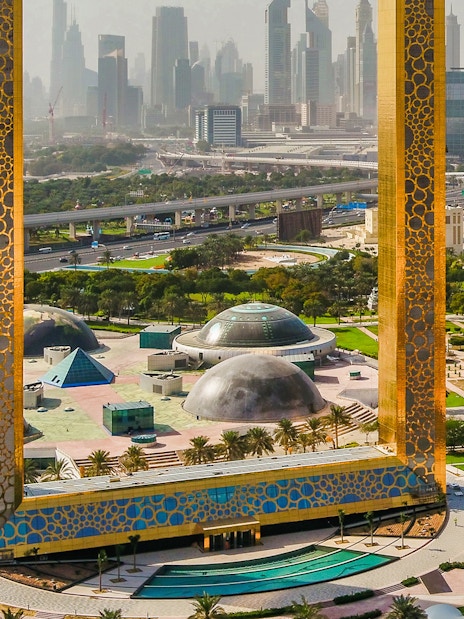 Dubai Frame with city skyline in the background, showcasing modern architecture.