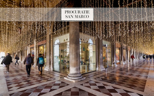 Procuratie San Marco arcade with lights, Venice Museums Pass tour.
