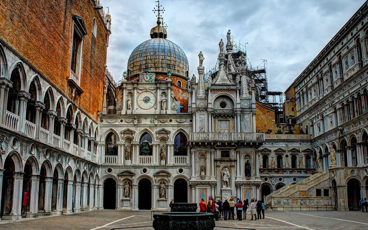 Doge's Palace courtyard with tourists, Venice walking tour.
