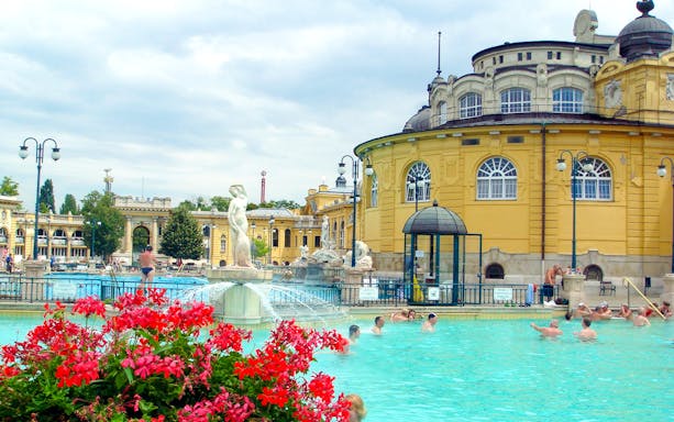 Széchenyi Spa outdoor pool with people swimming, Budapest, Hungary.