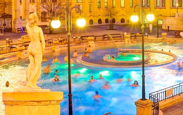 Széchenyi Spa thermal pool with people enjoying the water, Budapest.