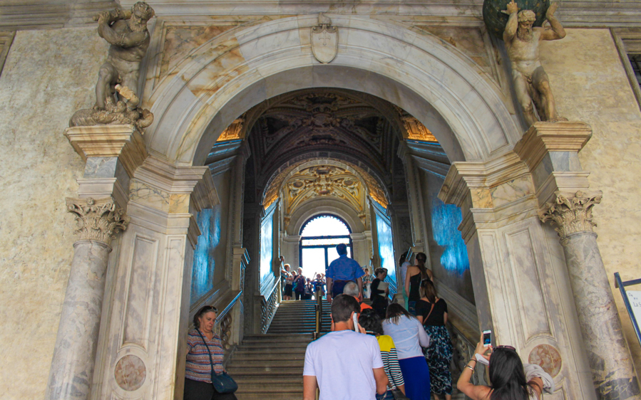 Visitors ascending the ornate staircase inside Doge’s Palace, Venice.