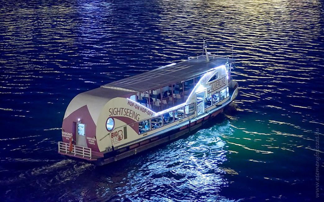 Sightseeing cruise boat on the Danube River at night, Budapest.