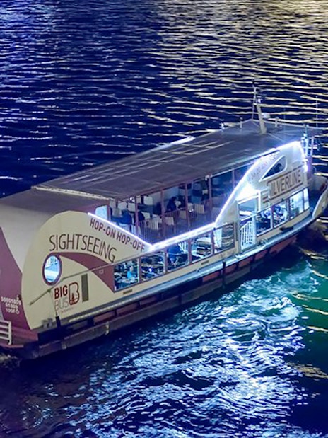 Sightseeing cruise boat on the Danube River at night, Budapest.