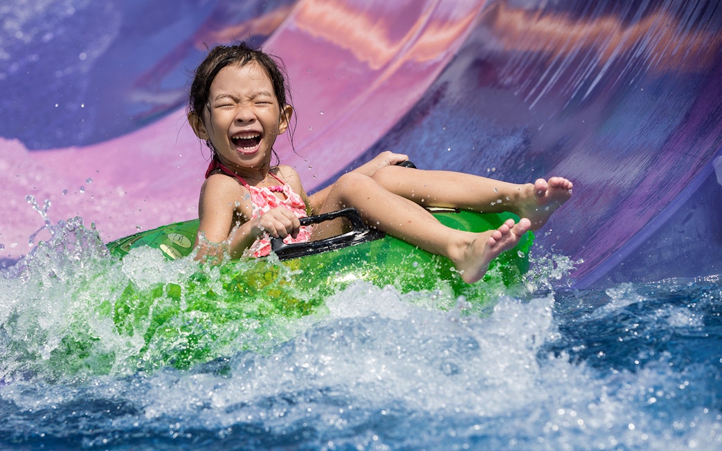 Girl on water slide at Wild Wild Wet Singapore.