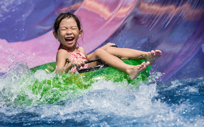 Girl on water slide at Wild Wild Wet Singapore.