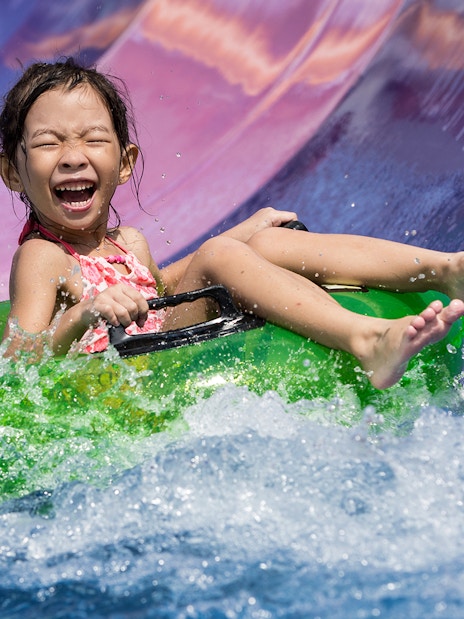 Girl on water slide at Wild Wild Wet Singapore.
