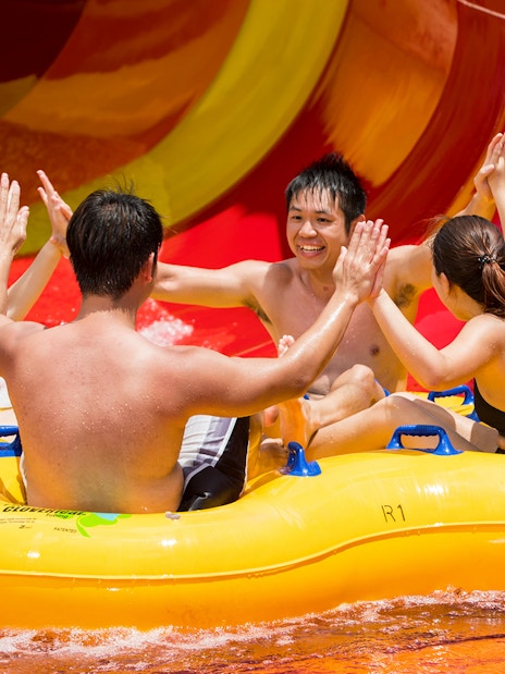Group enjoying a water slide ride at Singapore's Wild Wild Wet.