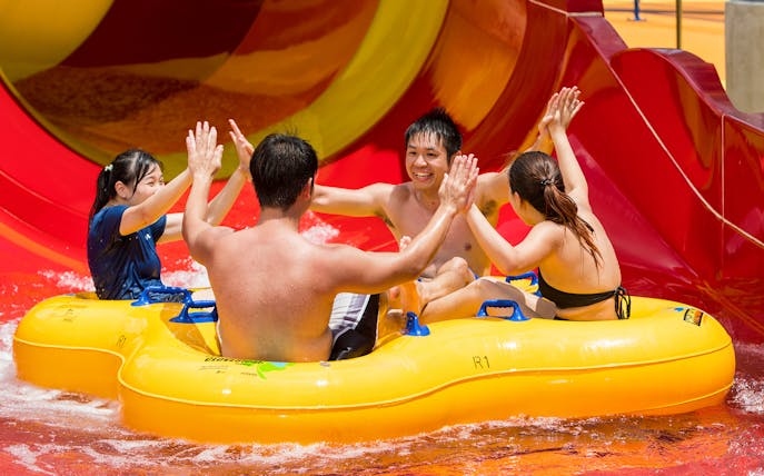 Group enjoying a water slide ride at Singapore's Wild Wild Wet.