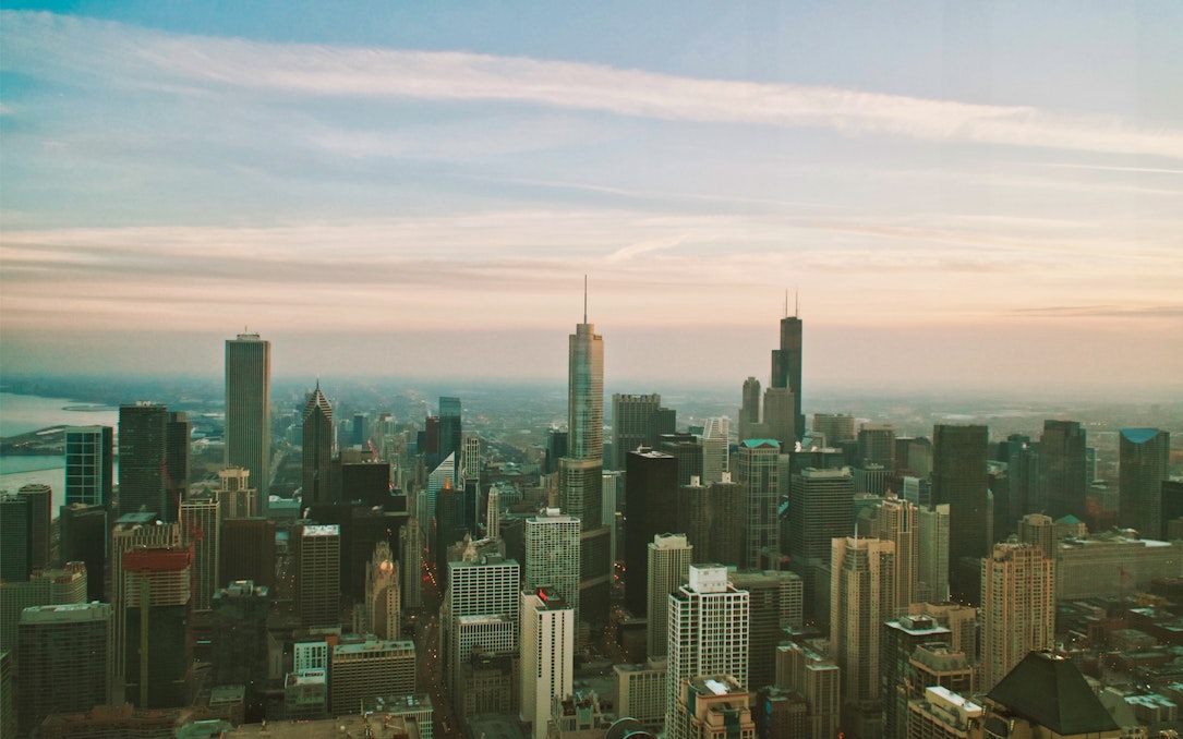 Chicago skyline view from 360 Chicago observation deck at sunset.