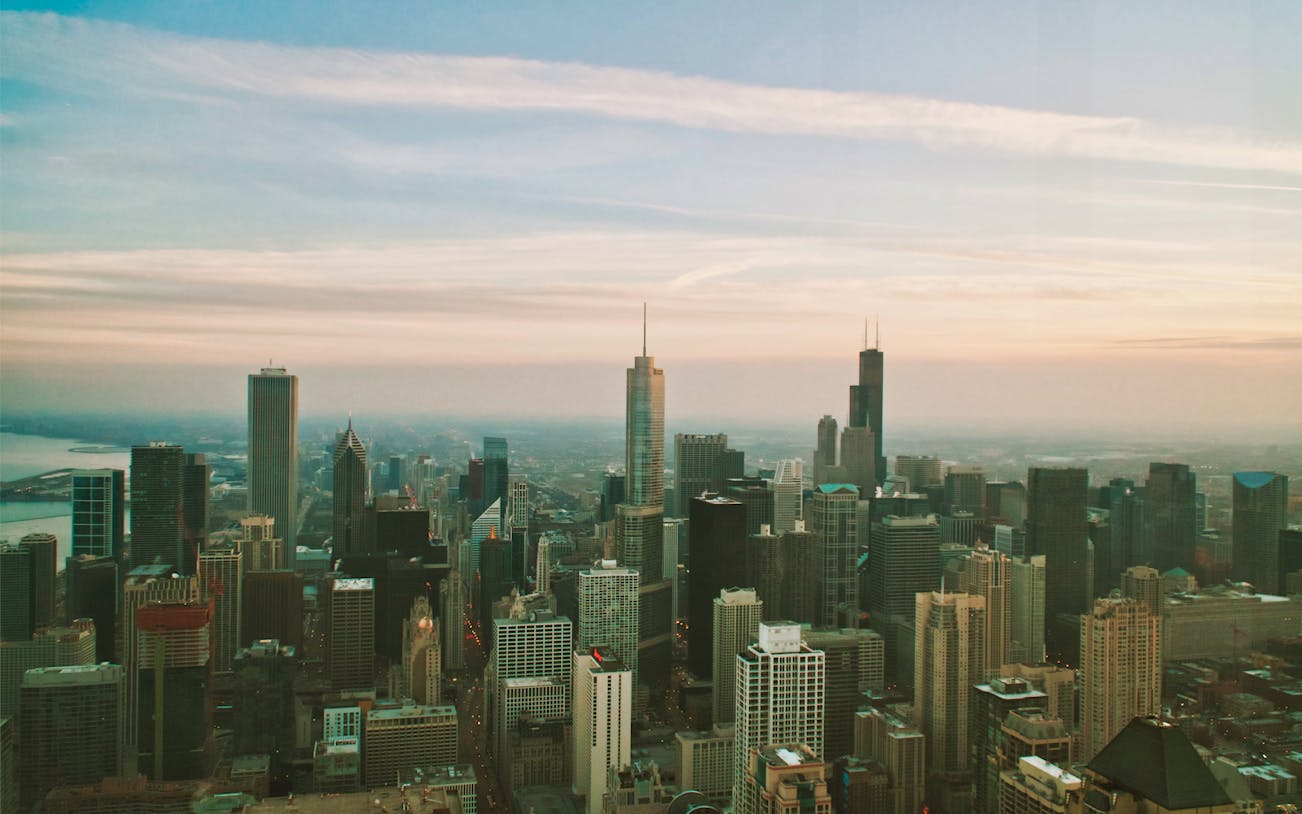 Chicago skyline view from 360 Chicago observation deck at sunset.