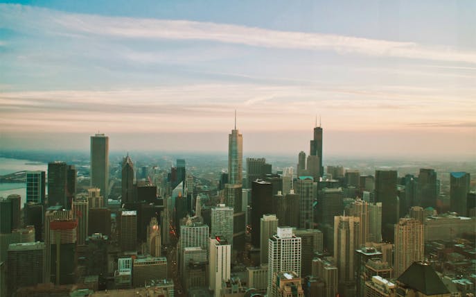 Chicago skyline view from 360 Chicago observation deck at sunset.