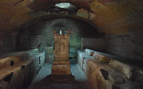 Ancient tomb in Catacombs of Domitilla on Appian Way tour.
