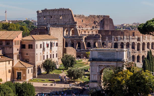Colosseum and Arch of Constantine in Rome on a sunny day.