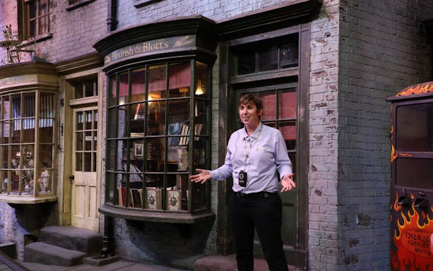 Guide explaining Flourish and Blotts set at Warner Bros. Studio Harry Potter Tour.