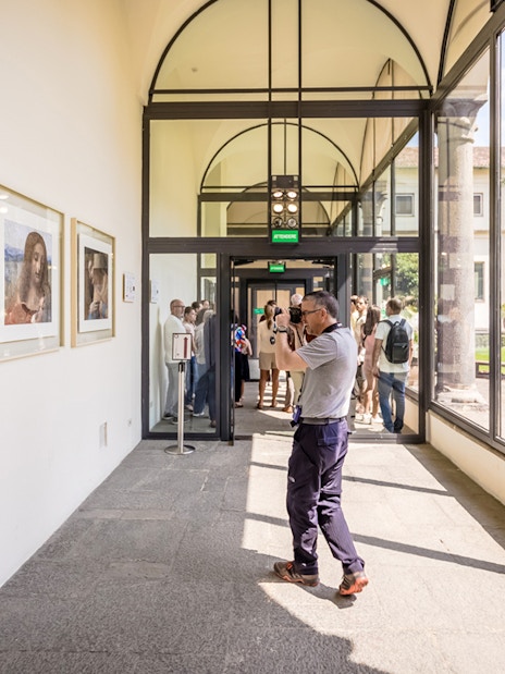 Tourists viewing art at The Last Supper Museum, Milan.