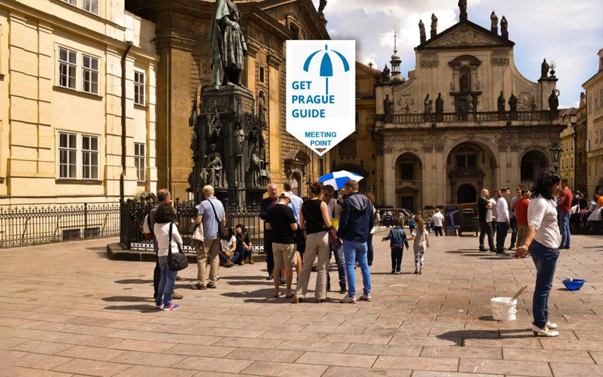 Tour group gathering at a meeting point in Prague's historic square for the Legendary Beer Tour.