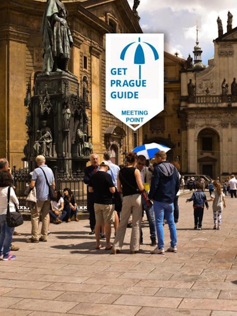 Tour group gathering at a meeting point in Prague's historic square for the Legendary Beer Tour.