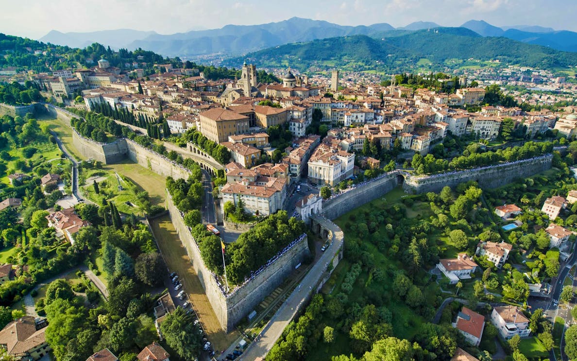Aerial view of Bergamo's historic city walls and buildings, Italy.