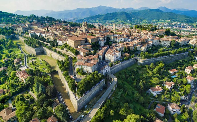 Aerial view of Bergamo's historic city walls and buildings, Italy.