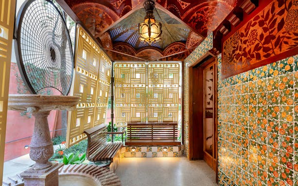Casa Vicens interior with decorative tiles and latticework in Barcelona.