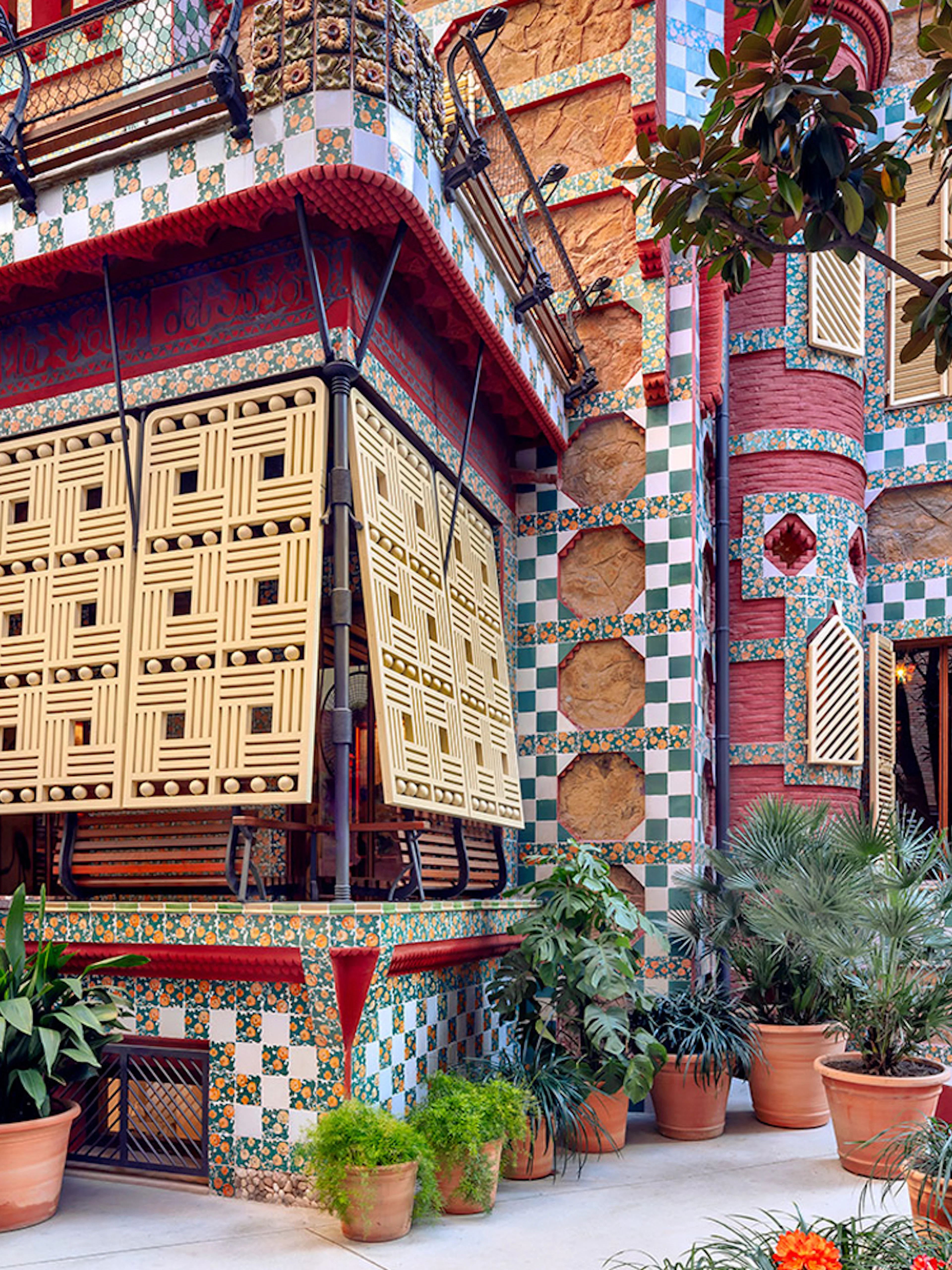 Casa Vicens facade with colorful tiles and intricate latticework in Barcelona.
