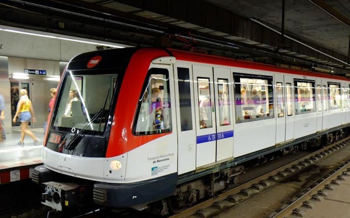 Barcelona metro train at a station platform, part of the Barcelona Express 2 Day Card experience.