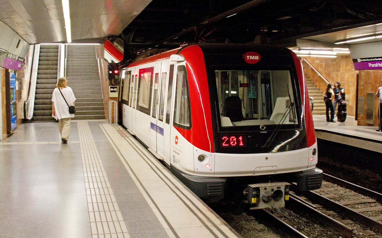 Barcelona metro train at a station platform, part of the Barcelona Express 2 Day Card experience.