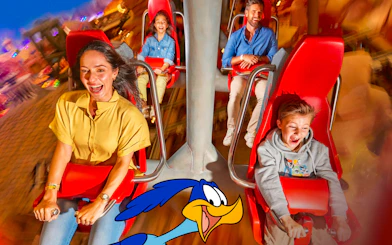 Visitors on a thrilling ride at Warner Bros. World Abu Dhabi.