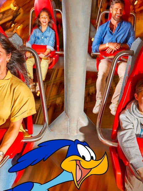 Visitors on a thrilling ride at Warner Bros. World Abu Dhabi.