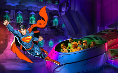 Visitors on a 3D ride at Warner Bros. World Abu Dhabi with Superman flying nearby.