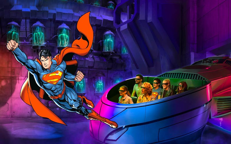 Visitors on a 3D ride at Warner Bros. World Abu Dhabi with Superman flying nearby.