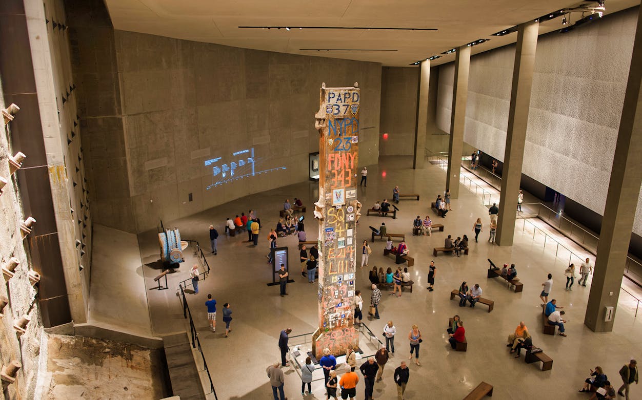 Visitors at the 9/11 Tribute Museum viewing the Last Column memorial.