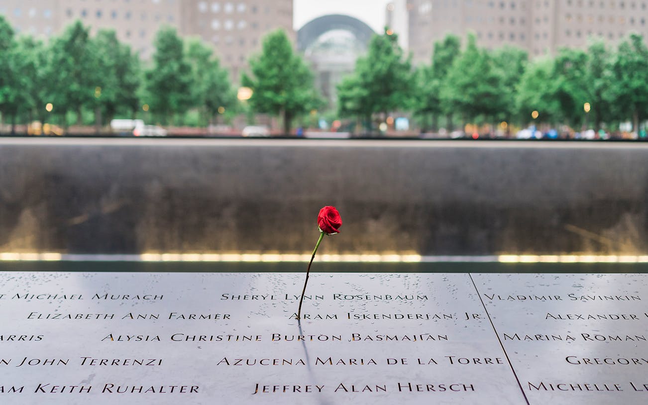 Red rose on 9/11 Memorial names panel at the 9/11 Tribute Museum, New York City.