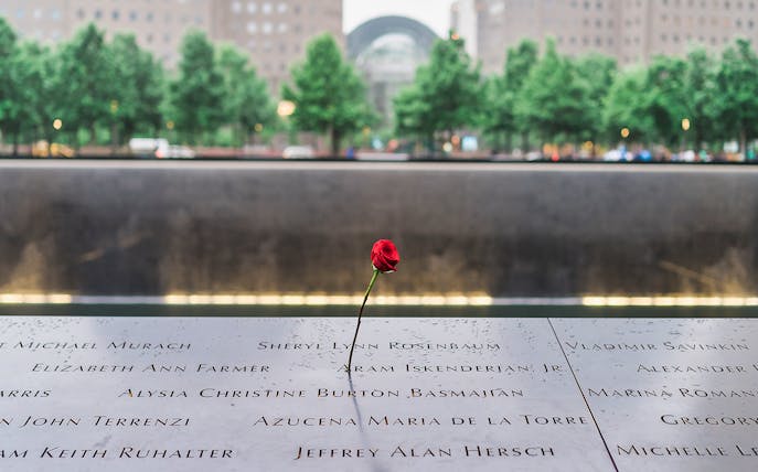 Red rose on 9/11 Memorial names panel at the 9/11 Tribute Museum, New York City.