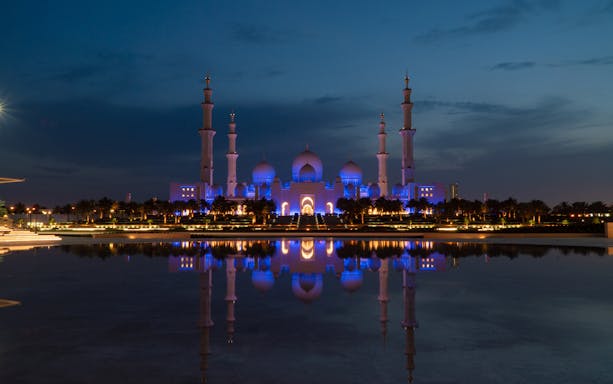 Sheikh Zayed Grand Mosque illuminated at night, Abu Dhabi City Tour.