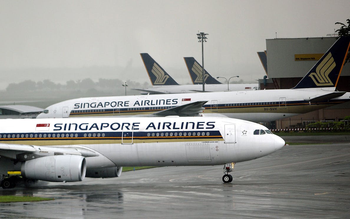 Singapore Airlines planes on tarmac at Singapore Airport for shuttle transfer.