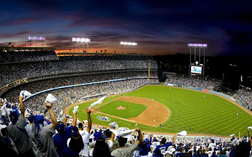 Fans cheering at a baseball game in Dodger Stadium, Los Angeles.