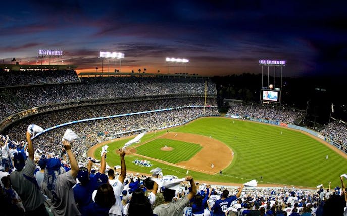 Fans cheering at a baseball game in Dodger Stadium, Los Angeles.