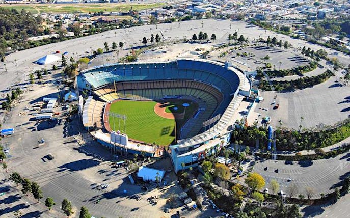 Aerial view of Dodger Stadium in Los Angeles, showcasing the baseball field and surrounding parking area.