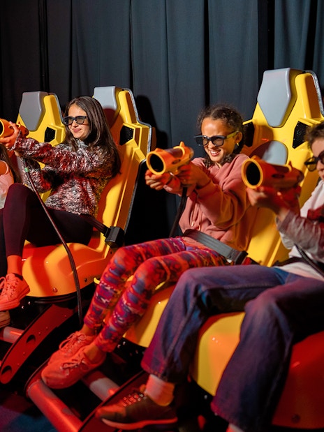 Children enjoying a VR ride at IMG World in Dubai.