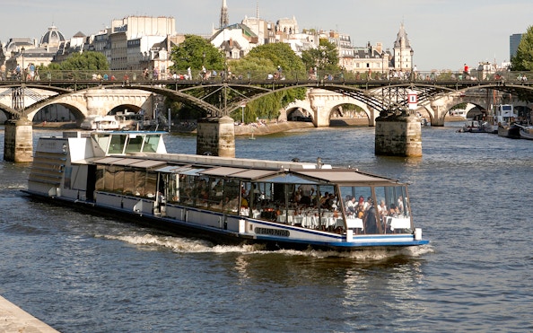 Lunch cruise boat on the Seine River near Pont des Arts, Paris.