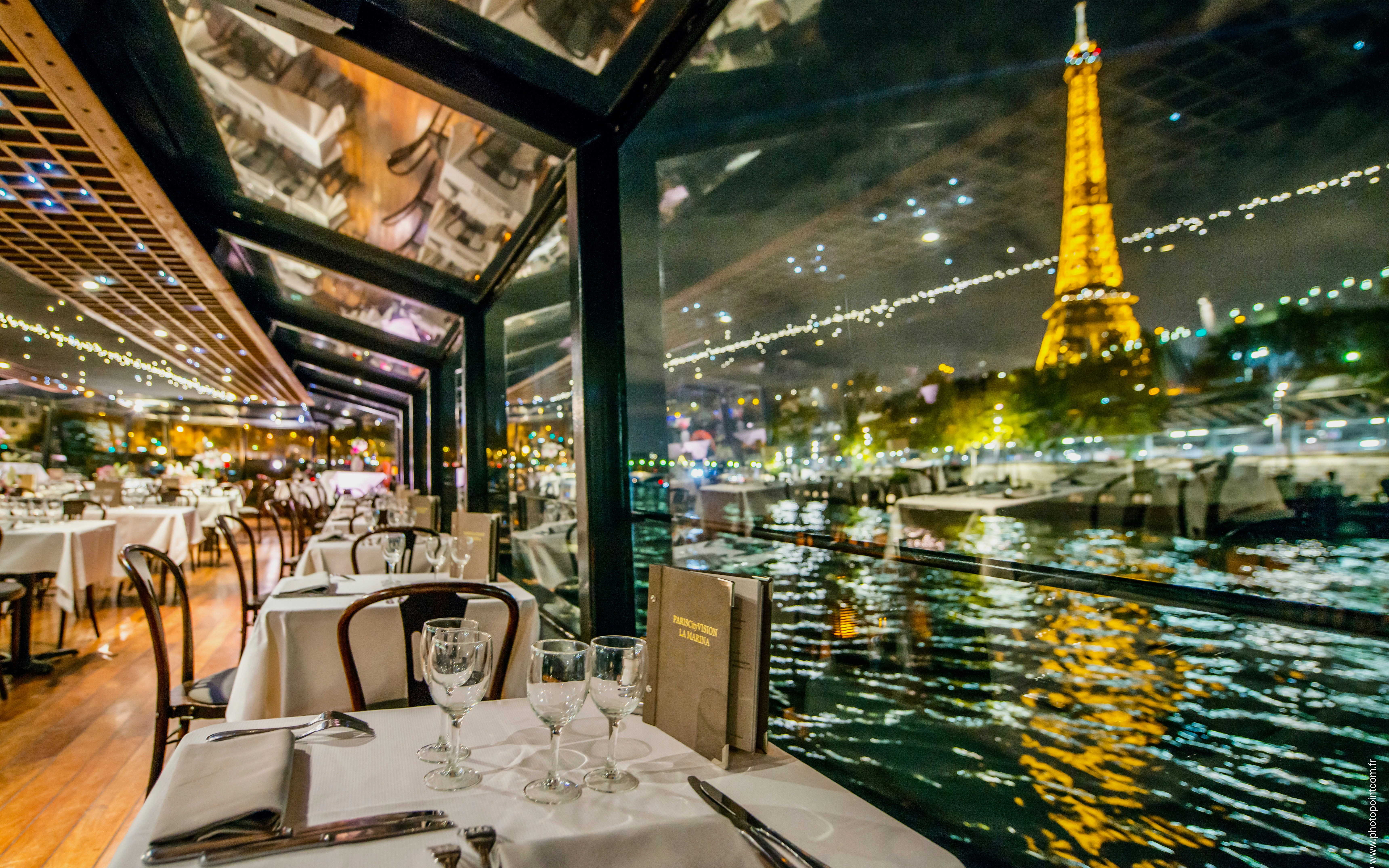 La Marina dinner cruise on Seine River, Paris, with champagne and illuminated Eiffel Tower.