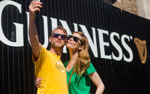 Couple taking selfie at Guinness Storehouse, Dublin.