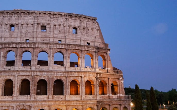 Colosseum in Rome at dusk, part of Skip the Line & Hop On Hop Off Bus Tour.